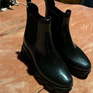 ankle booties, rubber outside, with a small heel. unsure of the brand
